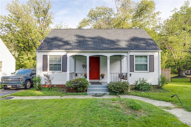 view of front of home featuring a porch and a front lawn