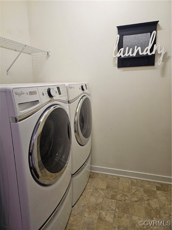 laundry area with washing machine and dryer