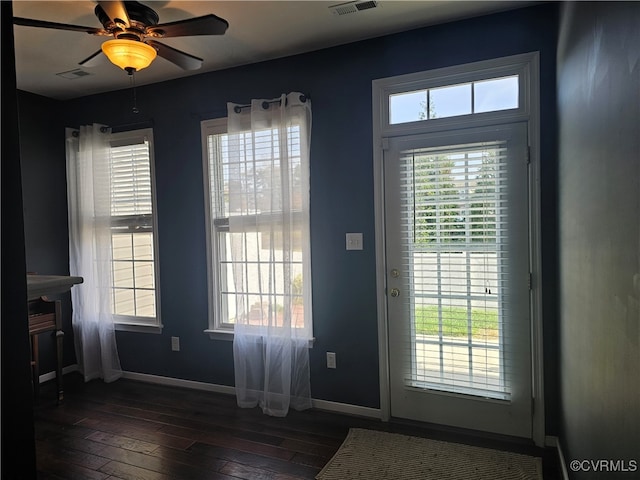 doorway to outside featuring dark hardwood / wood-style floors and ceiling fan