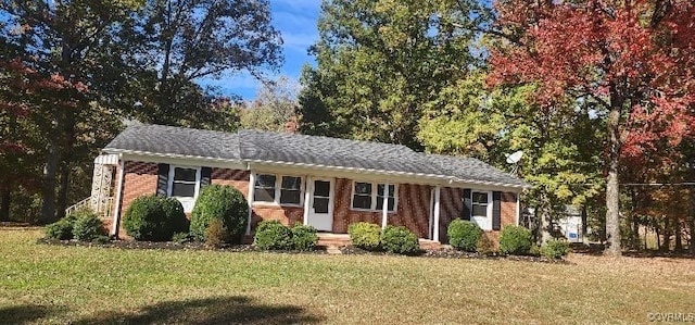 ranch-style house with a front lawn