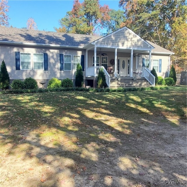 ranch-style home featuring a porch and a front lawn