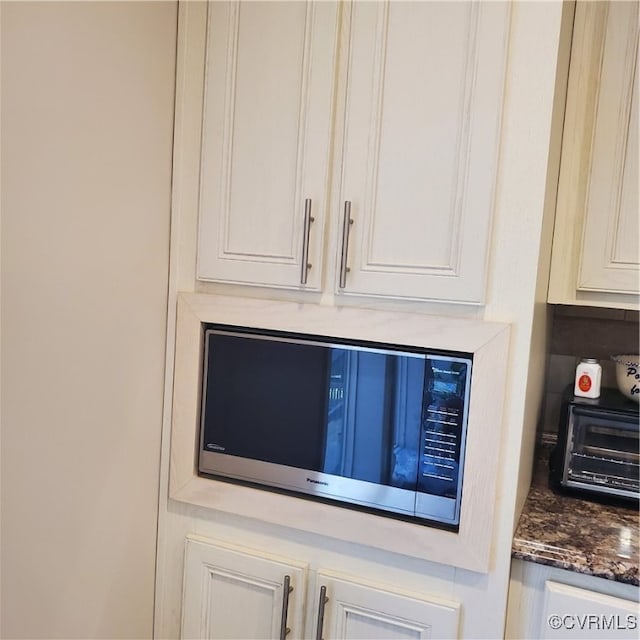 interior details featuring dark stone countertops