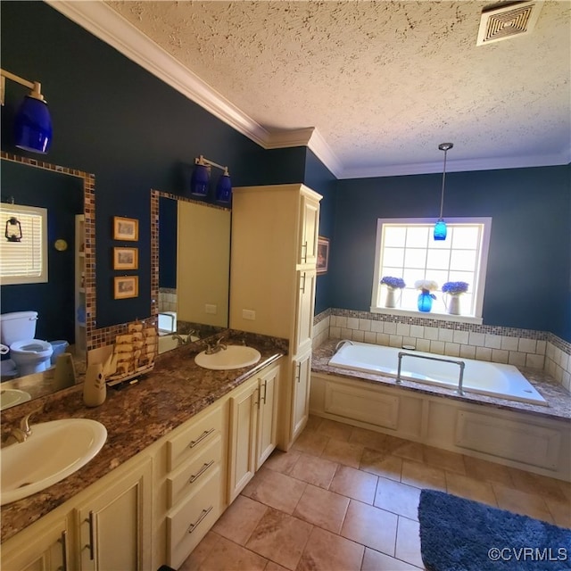 bathroom with a bath, a textured ceiling, tile patterned floors, vanity, and ornamental molding