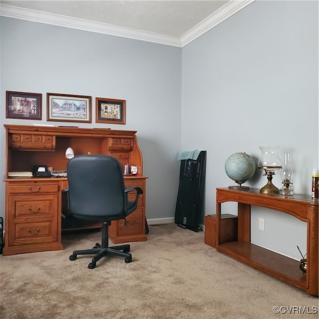 carpeted home office featuring crown molding