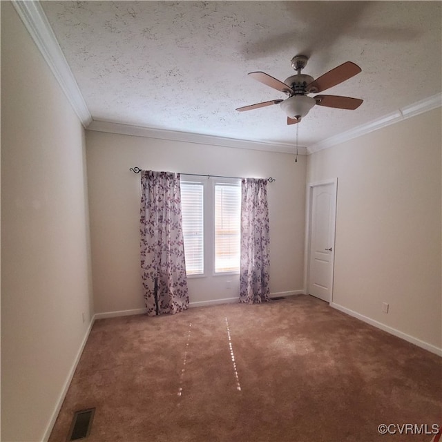 empty room with crown molding, a textured ceiling, carpet flooring, and ceiling fan