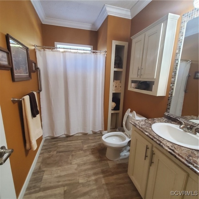 bathroom with vanity, toilet, crown molding, and a shower with curtain