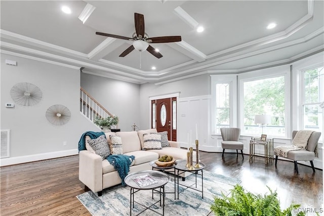 living room featuring crown molding, plenty of natural light, and dark hardwood / wood-style flooring