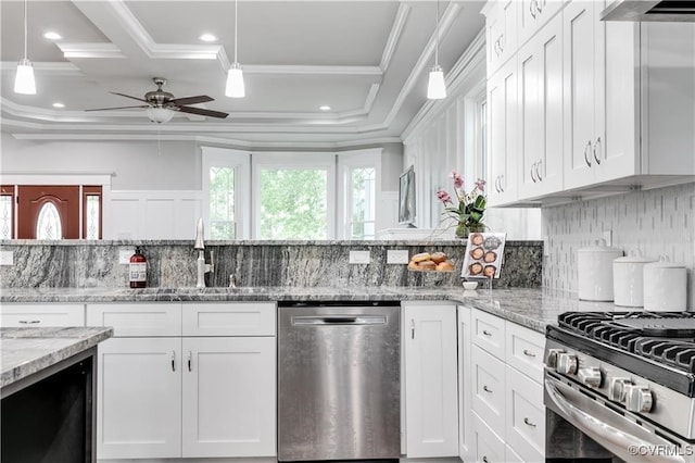 kitchen featuring light stone countertops, appliances with stainless steel finishes, sink, ceiling fan, and white cabinets