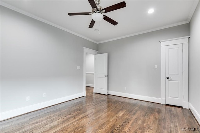 unfurnished bedroom featuring ornamental molding, dark hardwood / wood-style floors, and ceiling fan