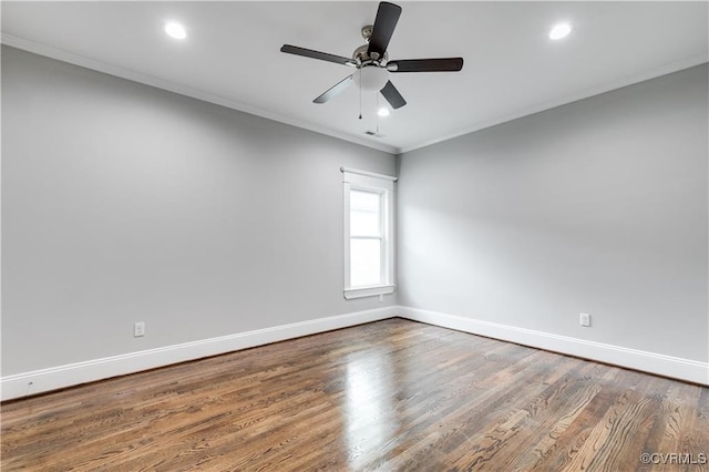 empty room with ceiling fan, ornamental molding, and hardwood / wood-style floors