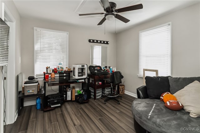 office area with dark hardwood / wood-style floors, a healthy amount of sunlight, and ceiling fan