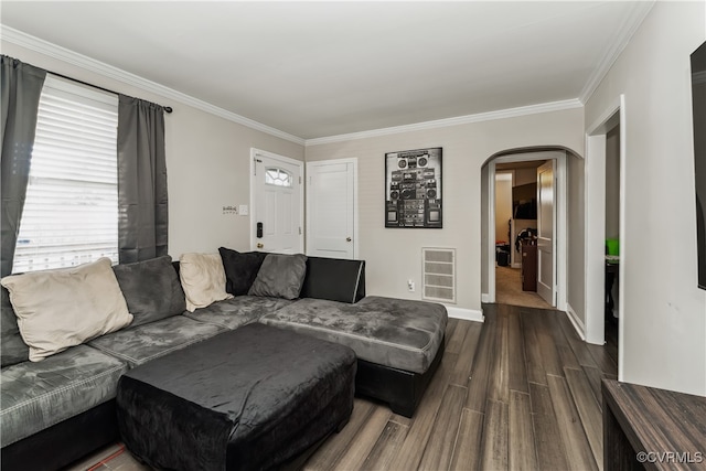 living room featuring ornamental molding and wood-type flooring