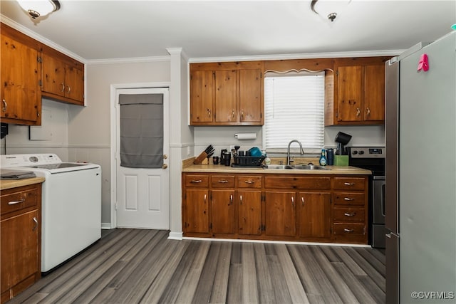 kitchen with washer / dryer, stainless steel appliances, sink, and dark hardwood / wood-style flooring