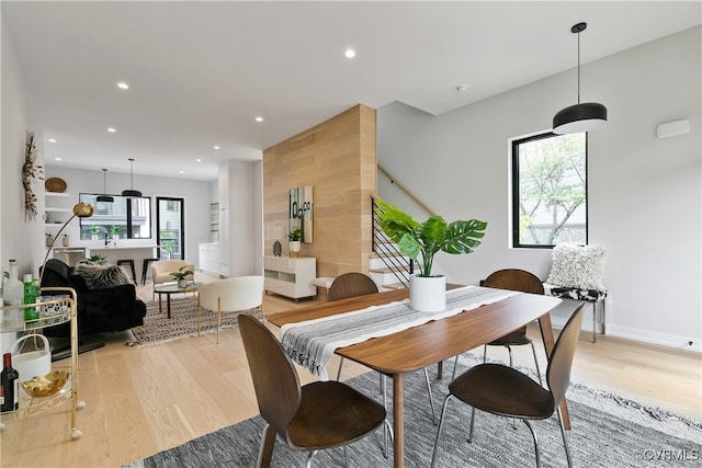 dining space with light hardwood / wood-style floors