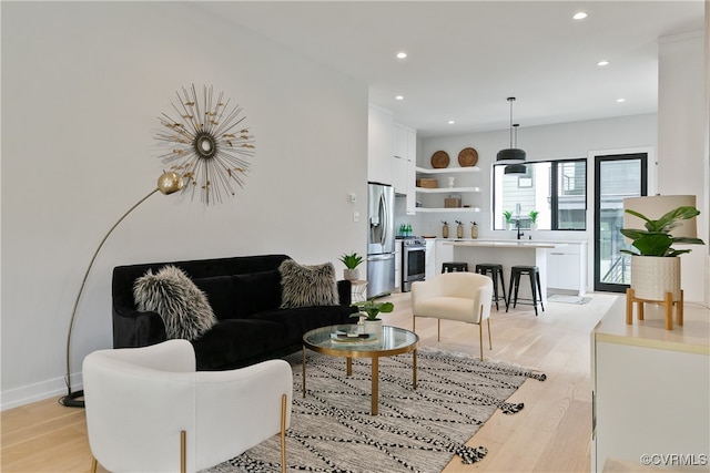 living room with light hardwood / wood-style flooring