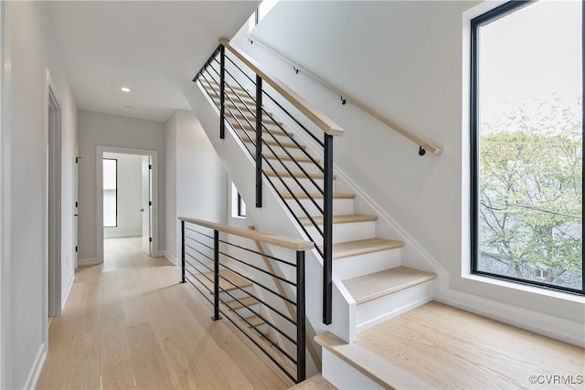 stairway featuring hardwood / wood-style floors