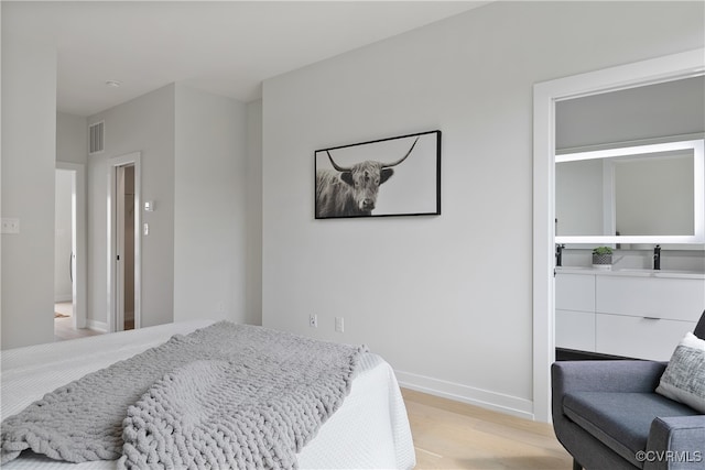 bedroom featuring light hardwood / wood-style floors