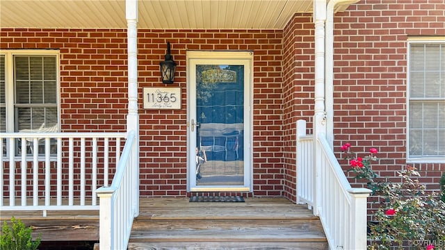 entrance to property with a porch