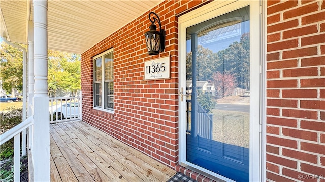 entrance to property featuring covered porch