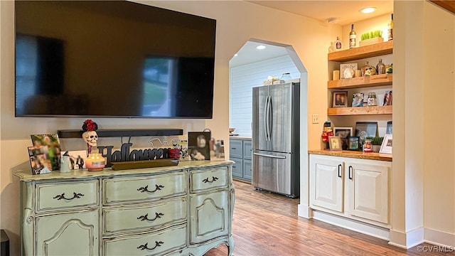 interior space with stainless steel refrigerator and light wood-type flooring