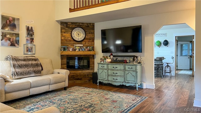 living room with dark hardwood / wood-style flooring