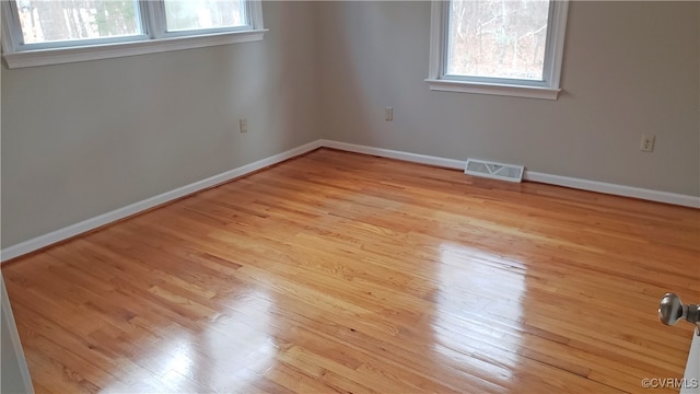 unfurnished room featuring light hardwood / wood-style floors