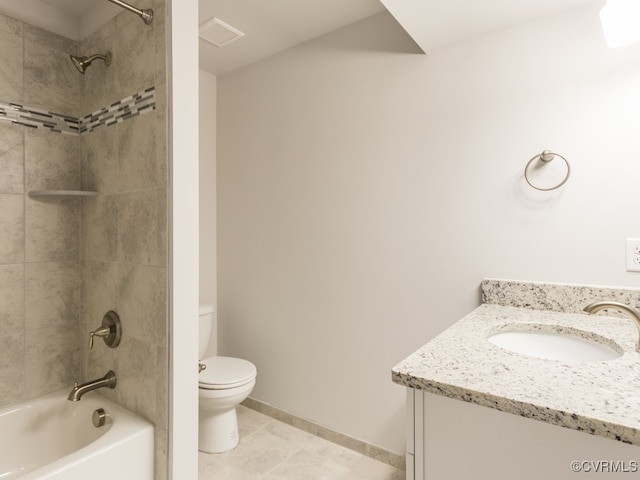 full bathroom with tiled shower / bath, vanity, toilet, and tile patterned flooring