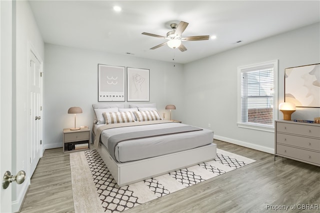 bedroom featuring ceiling fan and hardwood / wood-style floors