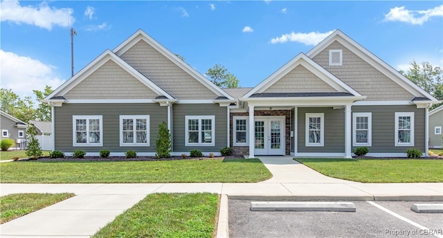 craftsman-style house with a front yard and french doors