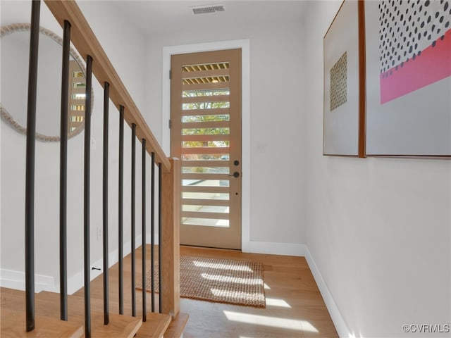 entryway with wood-type flooring