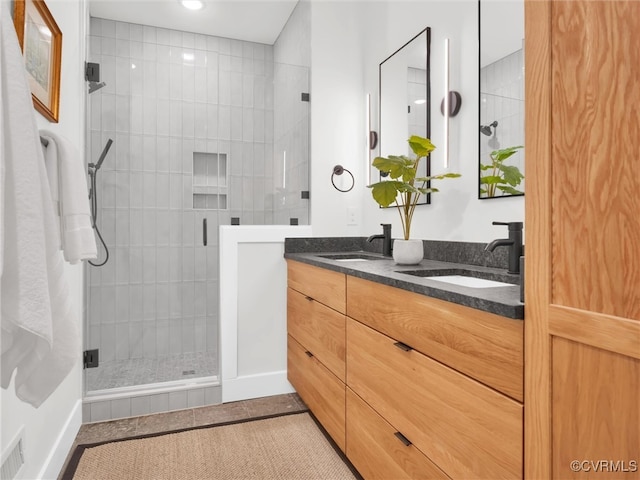 bathroom with vanity, tile patterned floors, and an enclosed shower