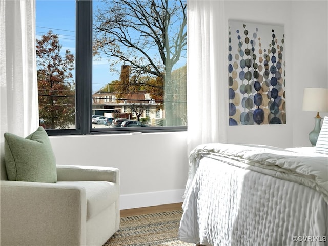 bedroom with hardwood / wood-style floors