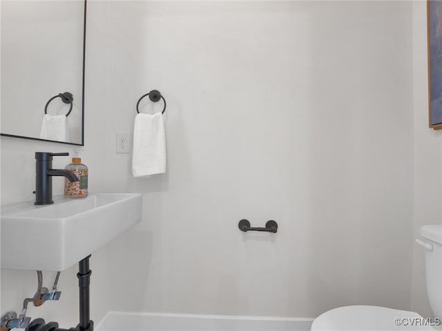 bathroom with toilet and sink