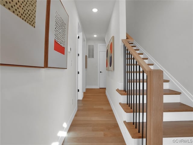 corridor with light wood-type flooring