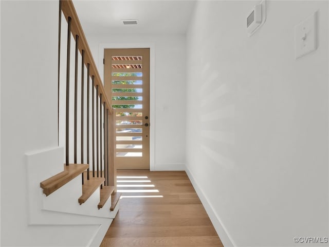 entryway with light hardwood / wood-style floors