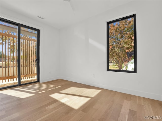 spare room featuring light hardwood / wood-style flooring