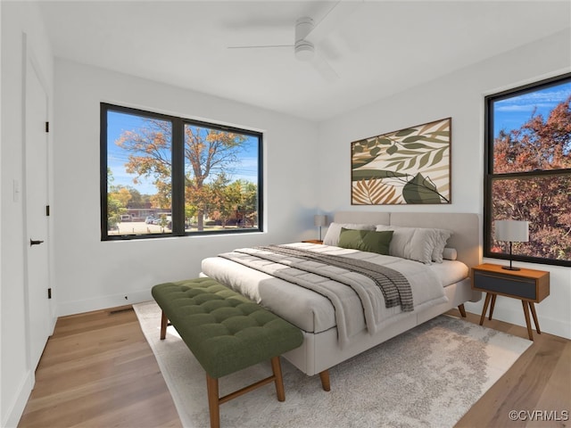 bedroom featuring light hardwood / wood-style floors and ceiling fan