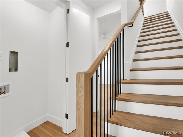 stairs with hardwood / wood-style flooring