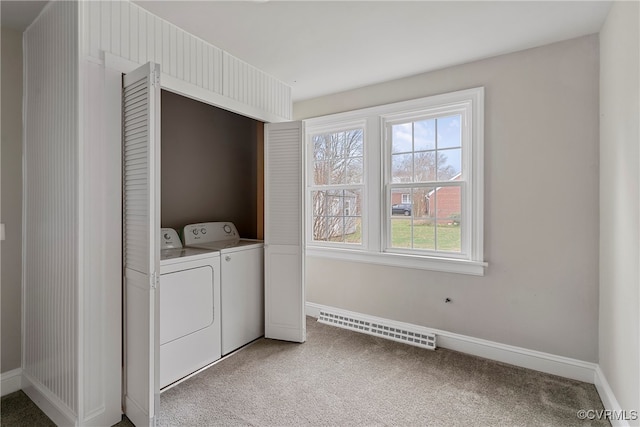 clothes washing area with washer and dryer and carpet floors