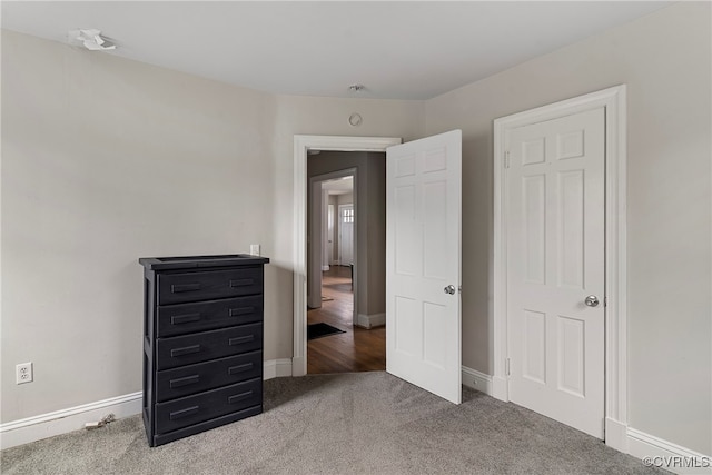 unfurnished bedroom with carpet floors