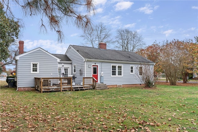 back of house featuring a yard and a wooden deck