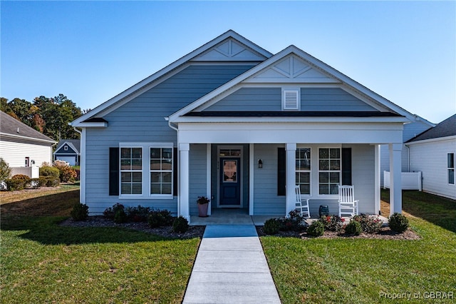 view of front of property featuring a porch and a front lawn