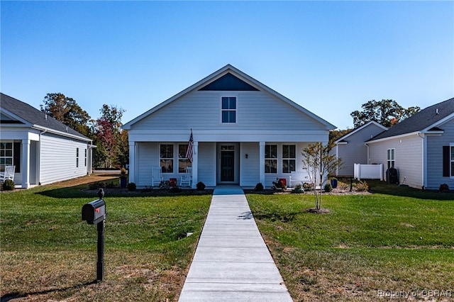 bungalow featuring a porch and a front yard