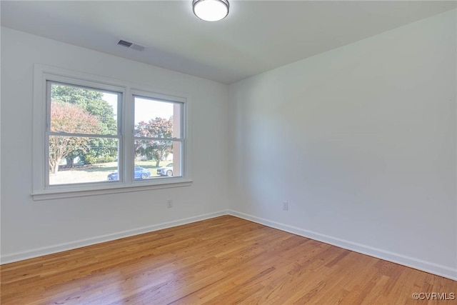 unfurnished room with light hardwood / wood-style flooring