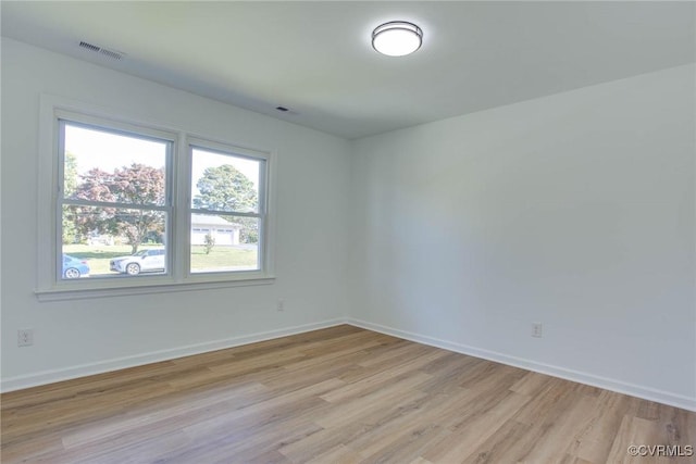 empty room with light wood-type flooring