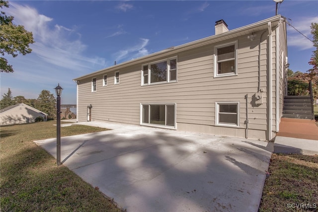 back of house featuring a patio area