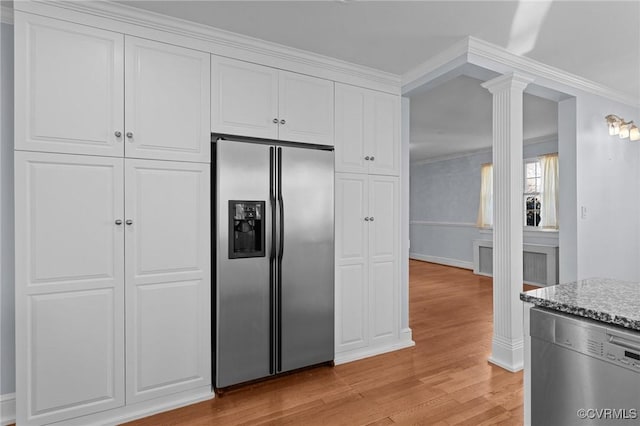 kitchen with white cabinets, light hardwood / wood-style floors, stainless steel appliances, and ornamental molding