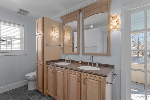 bathroom featuring ornamental molding, vanity, and toilet