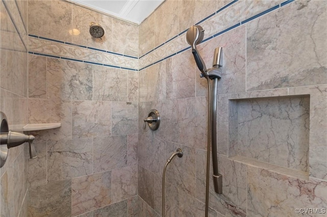 bathroom with a tile shower