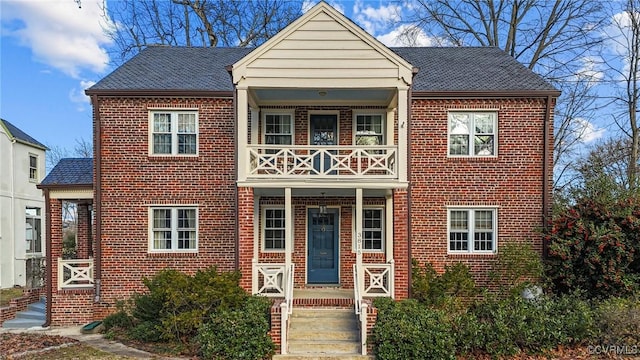 view of front of home featuring a balcony